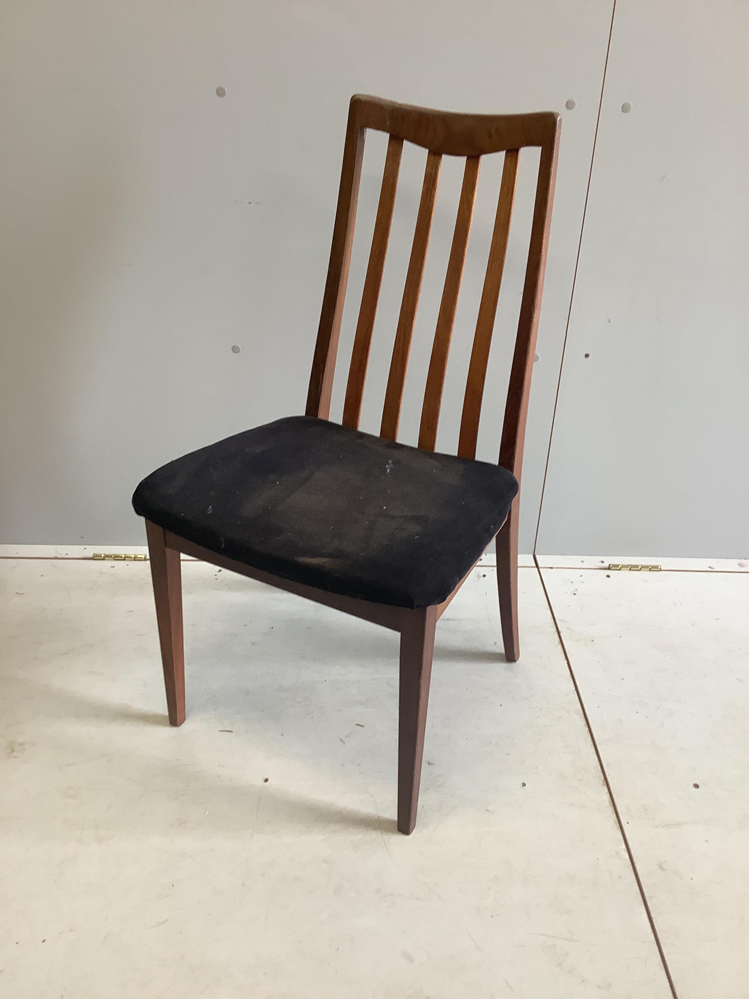 A G Plan circular teak extending dining table, diameter 120cm, height 74cm, and six chairs. Condition - fair